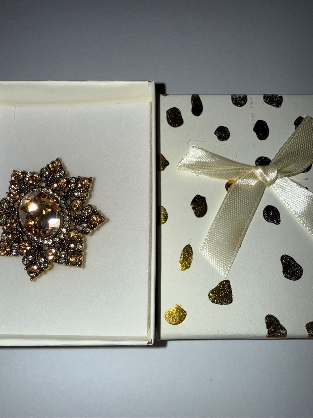 Gold-Tone Crystal Floral Star Brooch in Champagne